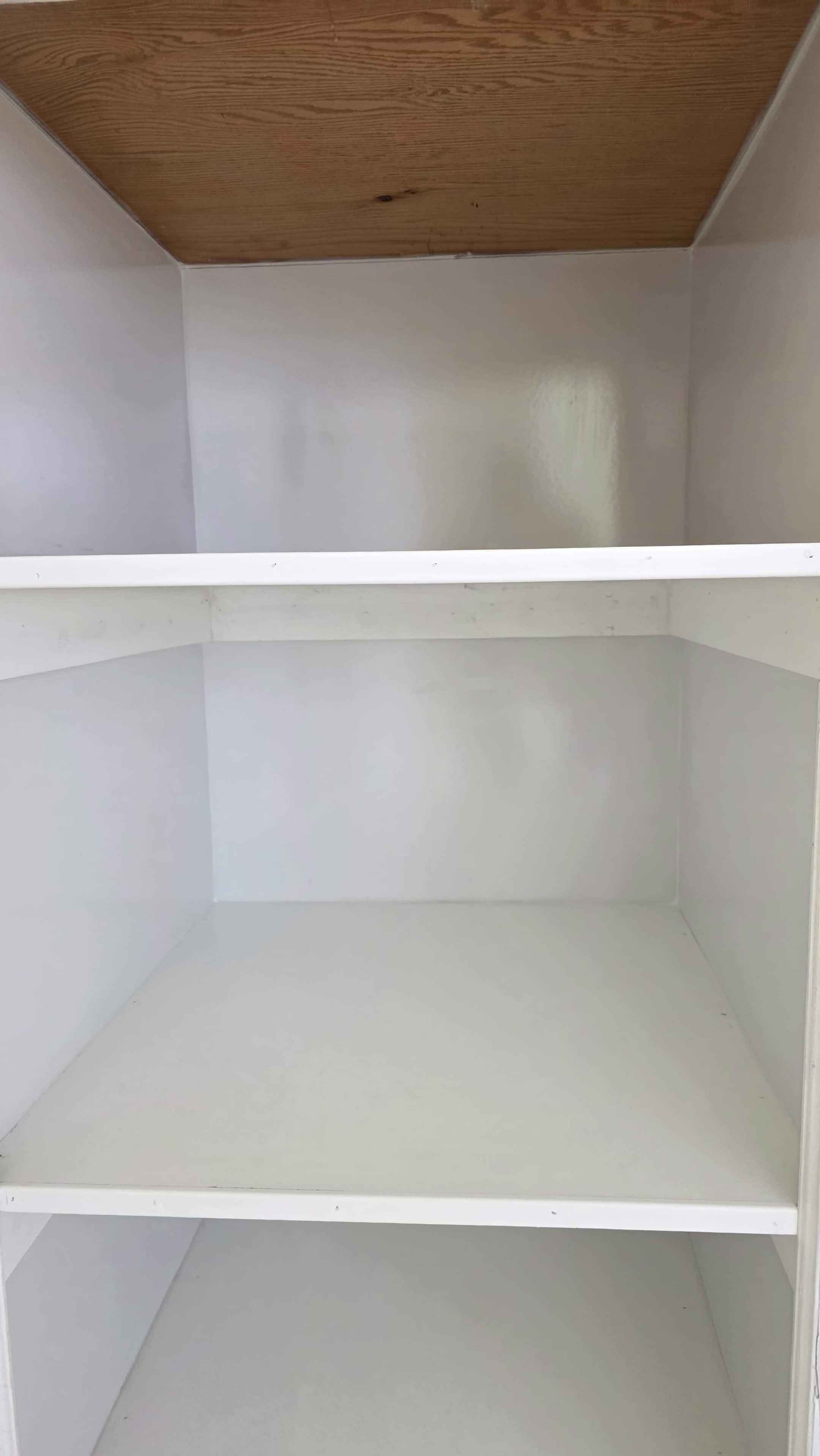 Finished closet with clean white shelving